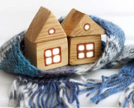 Toy houses wrapped in a scarf