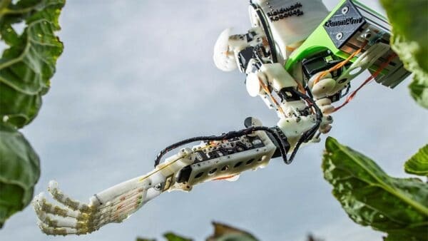 A robotic arm working in a field
