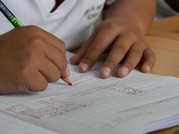 child working at a school desk