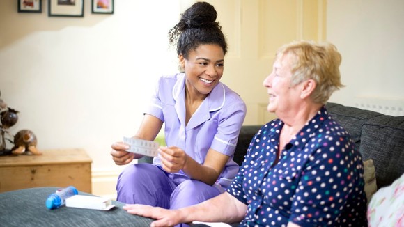 A care worker working with an older lady