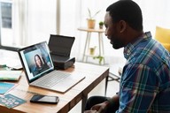 A man using a laptop.