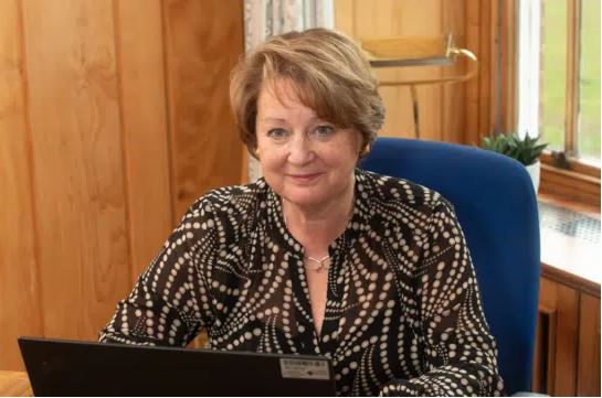 Jan Spicer at her desk