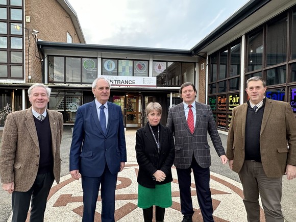 The Leader of Devon County Council, local Councillors and Cabinet Member, stood with the Head of Tiverton High School outside the school building