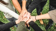 a group of hands joined together