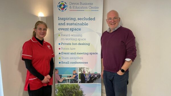 Care with Kindness Manager, Sarah, with the owner of the work hub, Steve