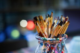 Paintbrushes in a jar