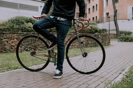 Man leaning on a bicycle