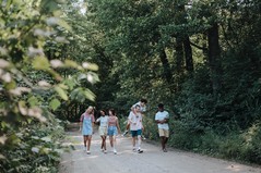 Group of teenagers walking in a forest
