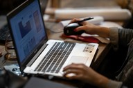 close up of a laptop screen with person using mouse