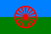 Traveller flag, red wheel on a blue and green background