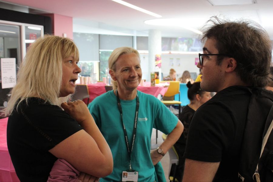 A young person chatting to the Council's Chief Executive, Donna Manson and Head of Economy and Skills, Keri Denton