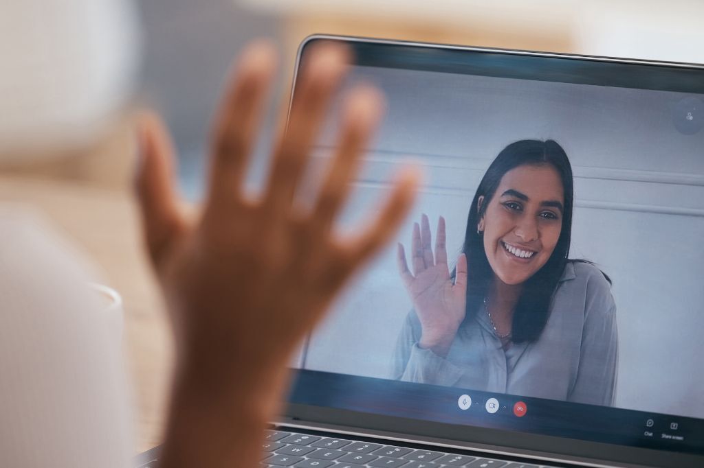 Person waving on a screen