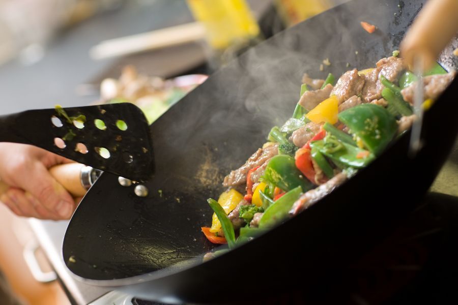 Cooking a nutritious meal - a wok with vegetable stir-fry