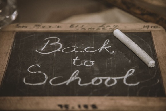 chalkboard with the words 'back to school' written on it