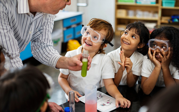 Primary children watching a Science experiment