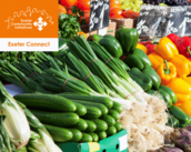Picture of veg at market with Exeter Connect logo