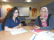 Sahar working with a student