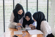 Three girls studying