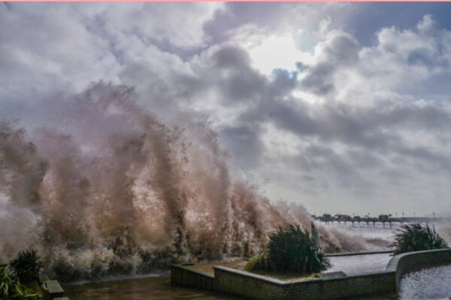 Huge waves crashing into the wall at Teignmouth sea front