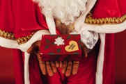 Santa holding a gift