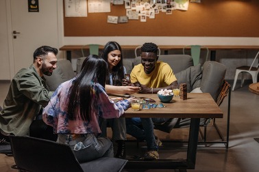 Teenagers Playing a Card Game Together