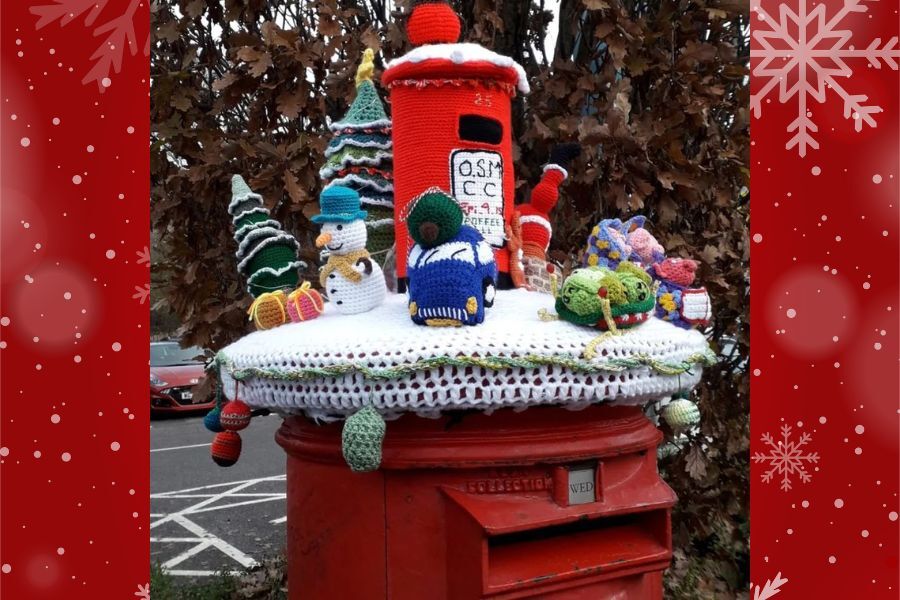 A wonderfully festive post box topper in Ottery St Mary by the talented crochet and chat ladies