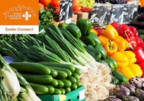 Exeter Connect logo on background of veg on a market stall