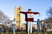 Scarecrows stood outside Parliament
