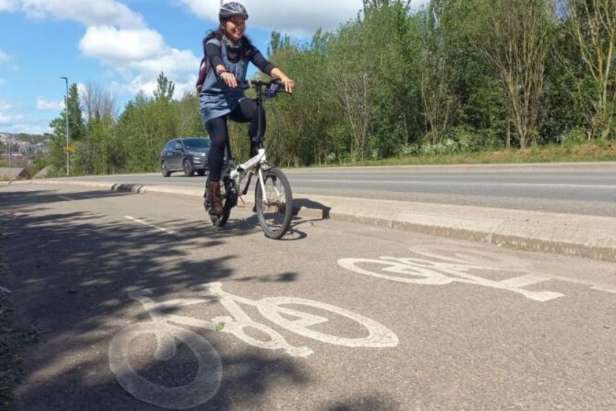 Woman cycling on cycle route