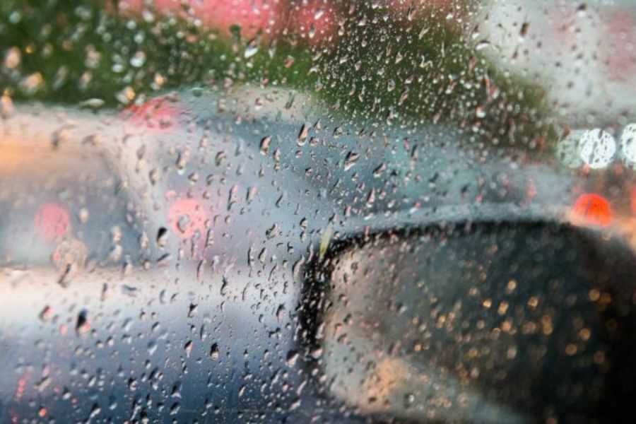 Car wing mirror in the rain