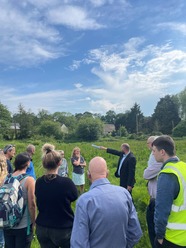 group of people standing in a field 