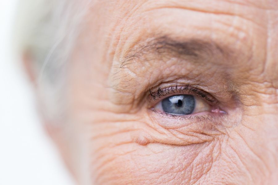 A close up photo of an elderly lady. Photo shows her eye and side of her face.