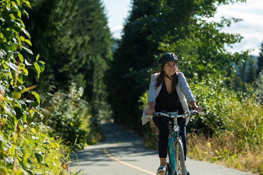 A woman cycling on a cycle path