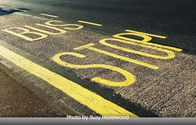 bus stop written on the road surface in yellow