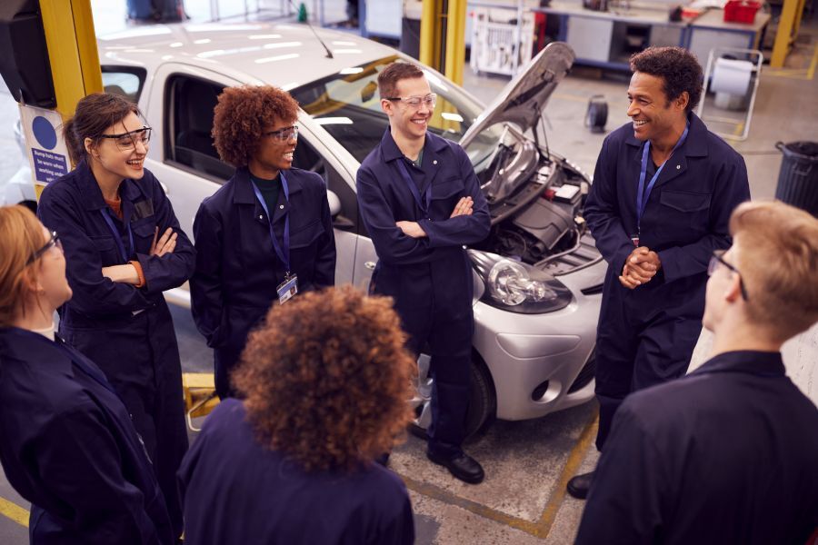 teenagers on mechanic apprenticeship