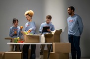 volunteers boxing foods to be distributed Photo by cottonbro studio