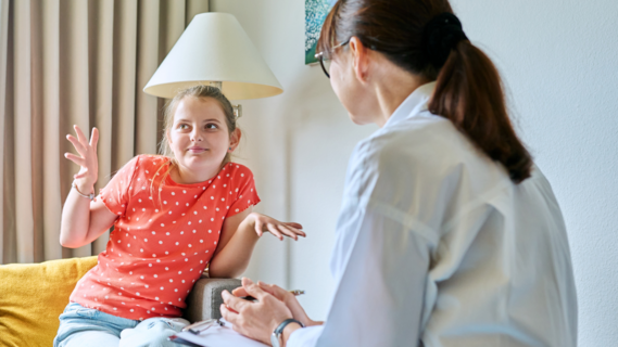 Professional woman talking to young person