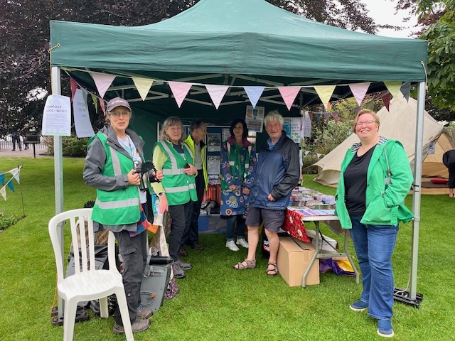 Exmouth's Eco Gazebo at Exmouth Festival 2024, with Green Team volunteers, Cllr Tim Dumper and Catherine Causley (EDDC Climate Officer). 