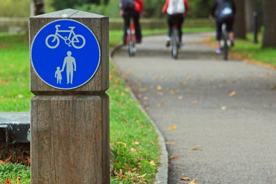 A signpost indicating that the route is for walking and cycling