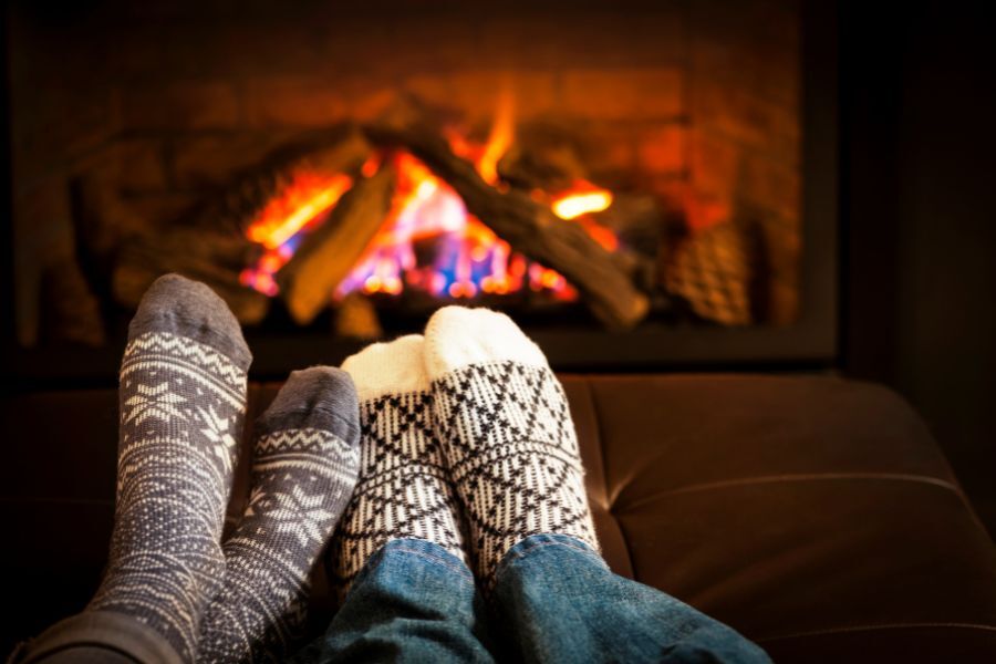 Feet in front of an open fire