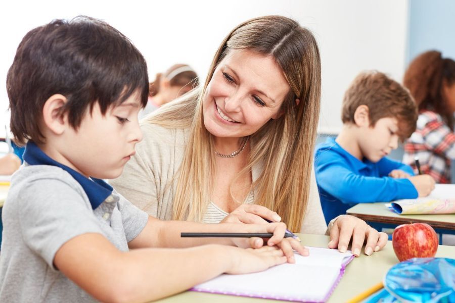 Woman in classroom with child