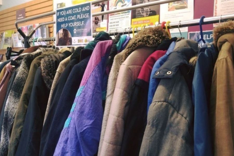 Coats on a rail in a library