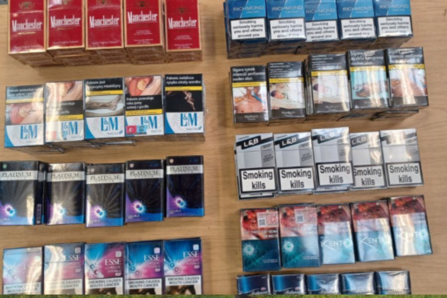 rows of cigarette packets on a wall