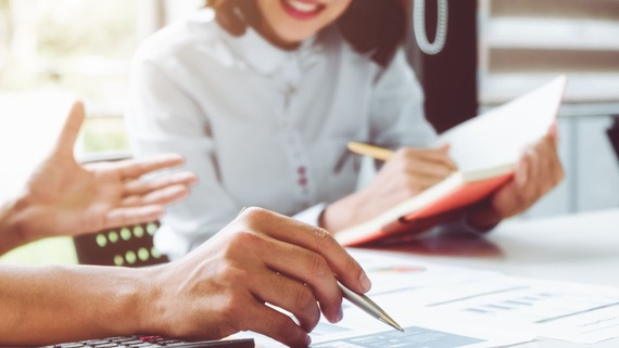 Hands on paper and pen