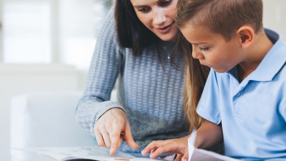 Child with adult supporting them