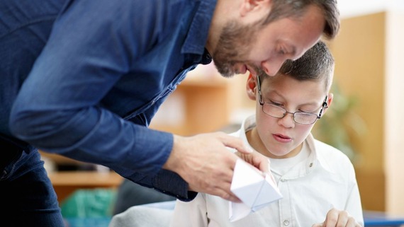 Adult working with child