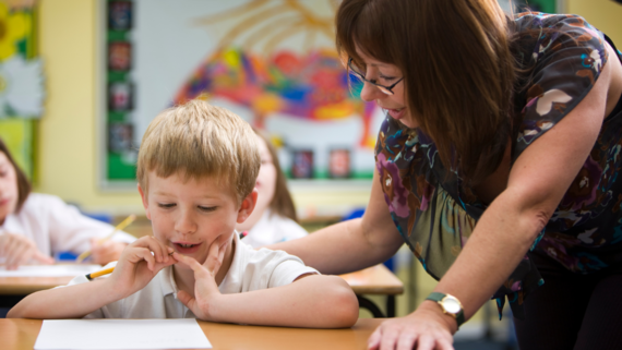 Professional working with child in school