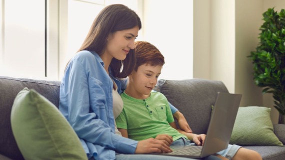 Mother and son on laptop