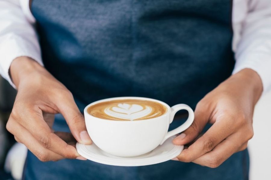 Hands holding a coffee