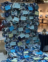 Display in a shopping centre made from crafted puddles, to form a 'flood'